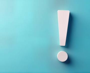 white exclamation mark against teal background