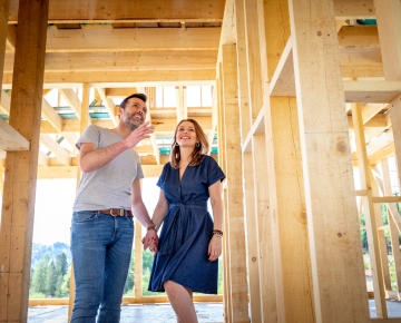couple looking at home being constructed