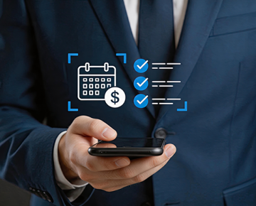 man in blue suit holding phone with icons floating above