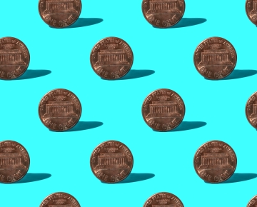 pennies against light blue background