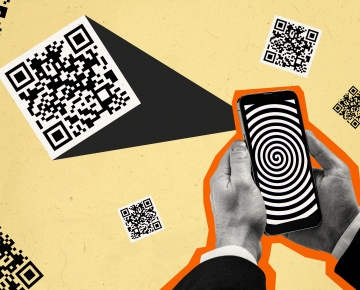 hands holding phone scanning QR codes against yellow background