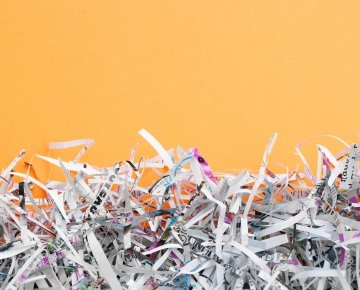 shredded paper on orange background