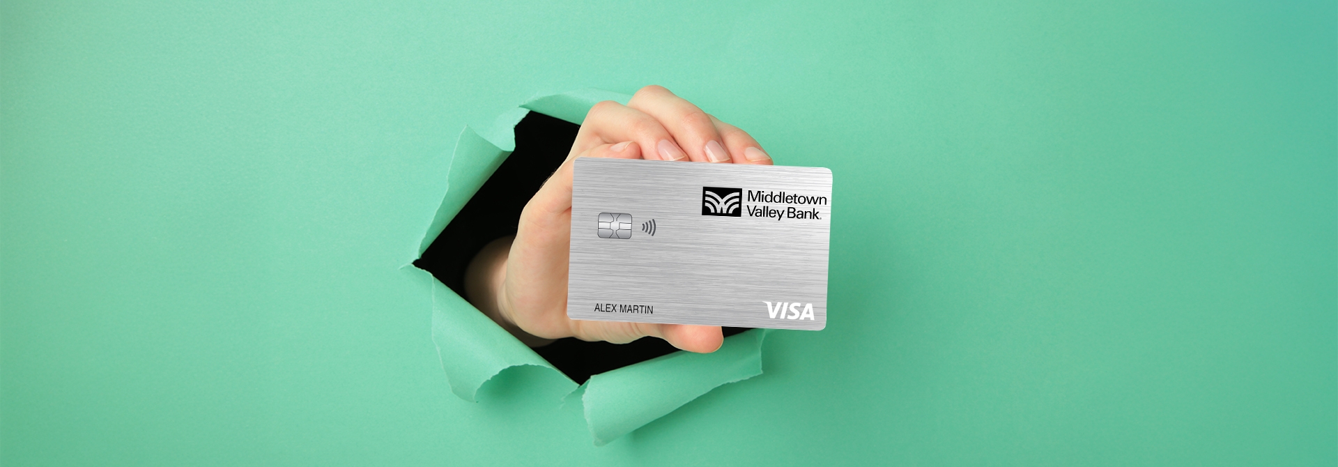Hand holding a credit card. 