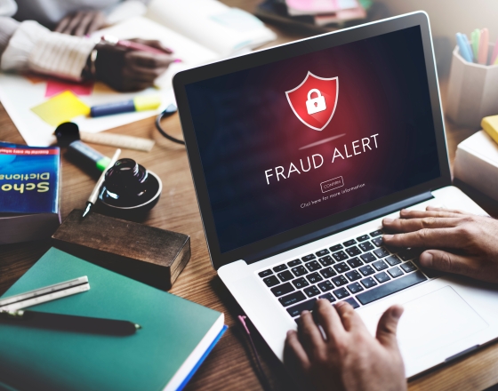 Fraud alert on a laptop