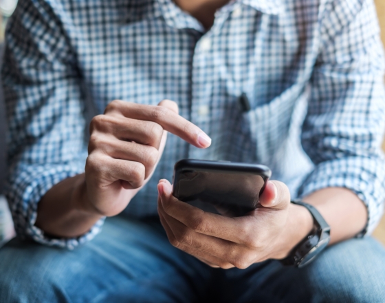 Man Looking At Phone